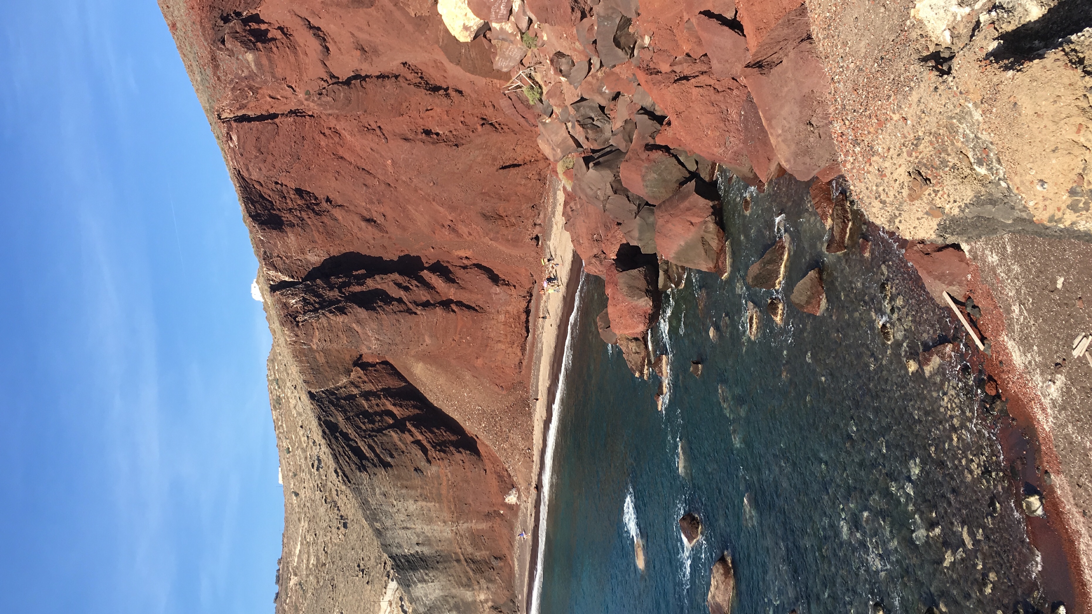 Red beach on Santorini Island. The Mediterranean Sea here is very warm.