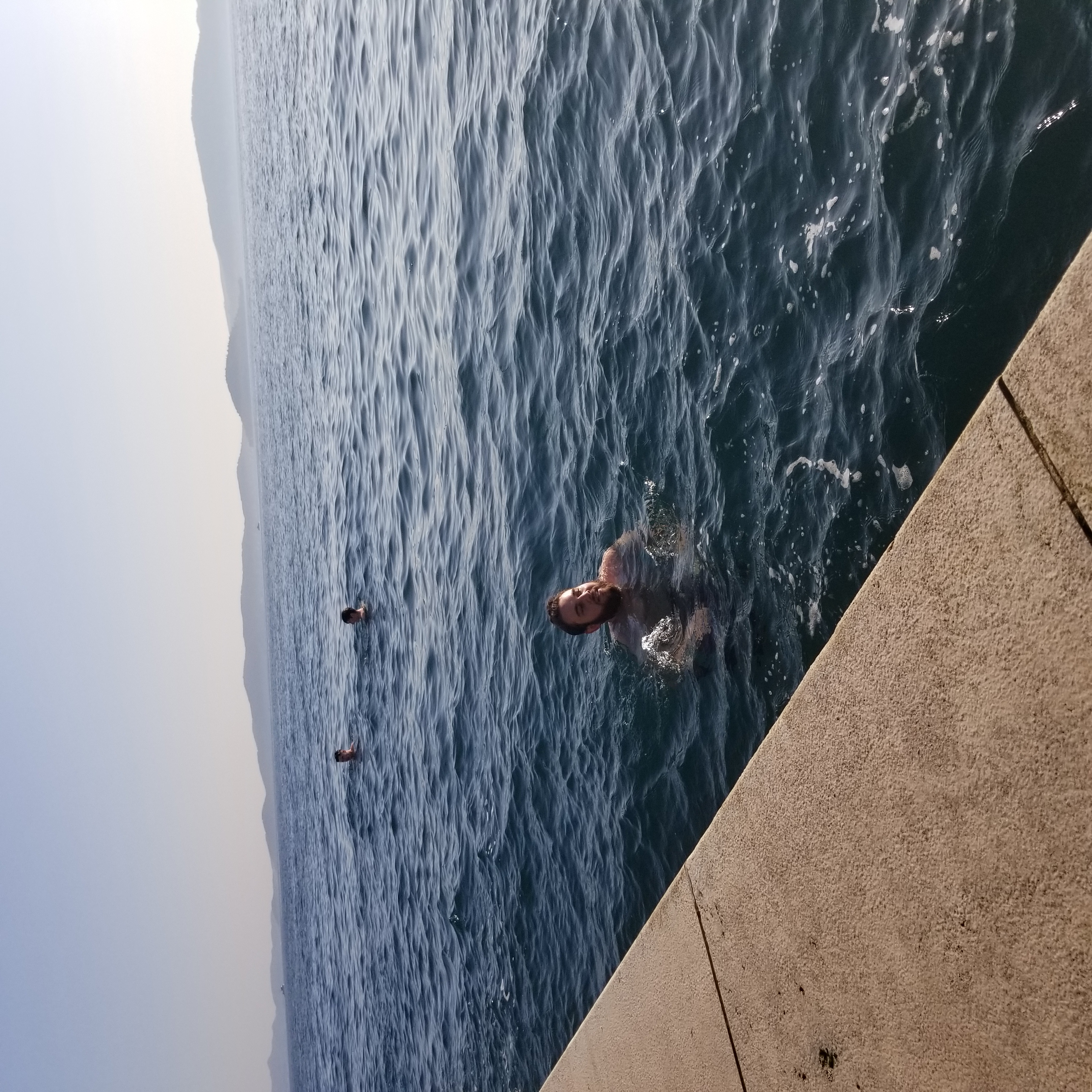 Josh takes a swim next to the sea organ in Zadar, Croatia