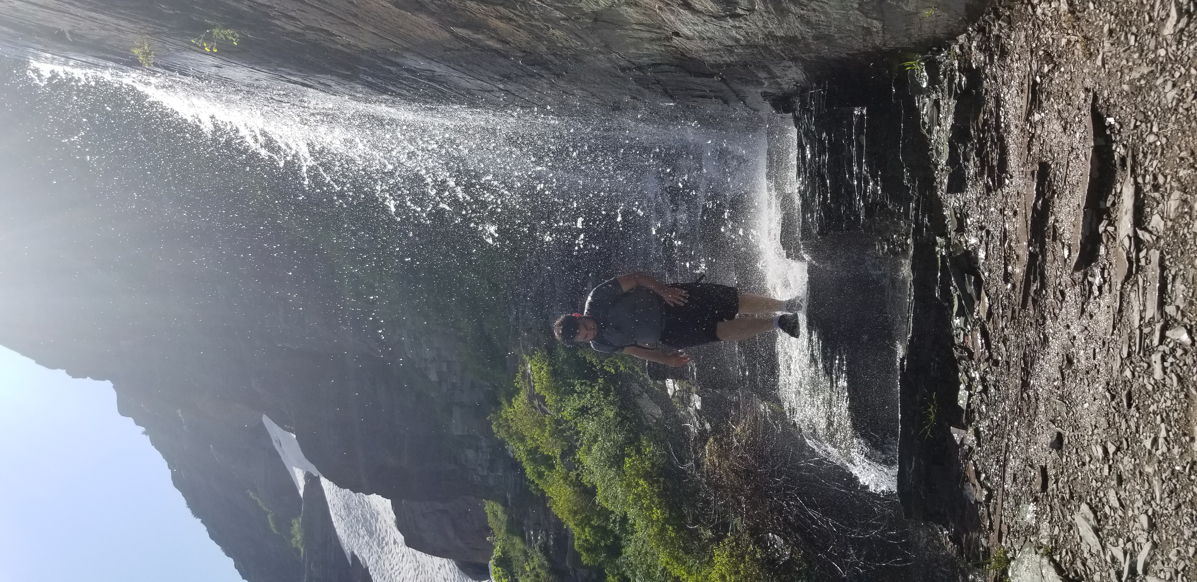 Josh discovering that water is wet on the hike to Grinnell glacier in Glacier NP, MT