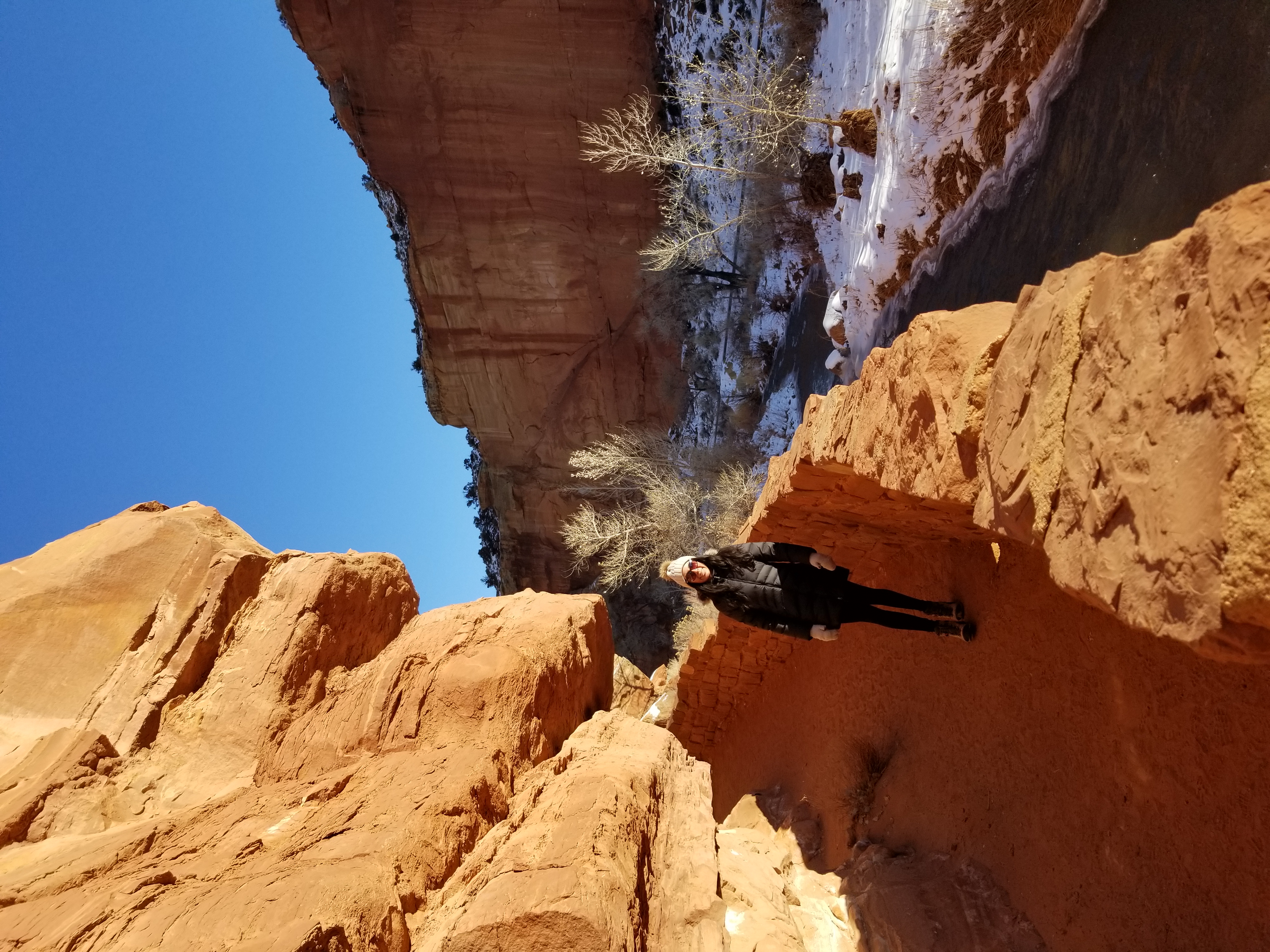 Zelzah starting up the trail to the top of the cliffs in Capitol Reef