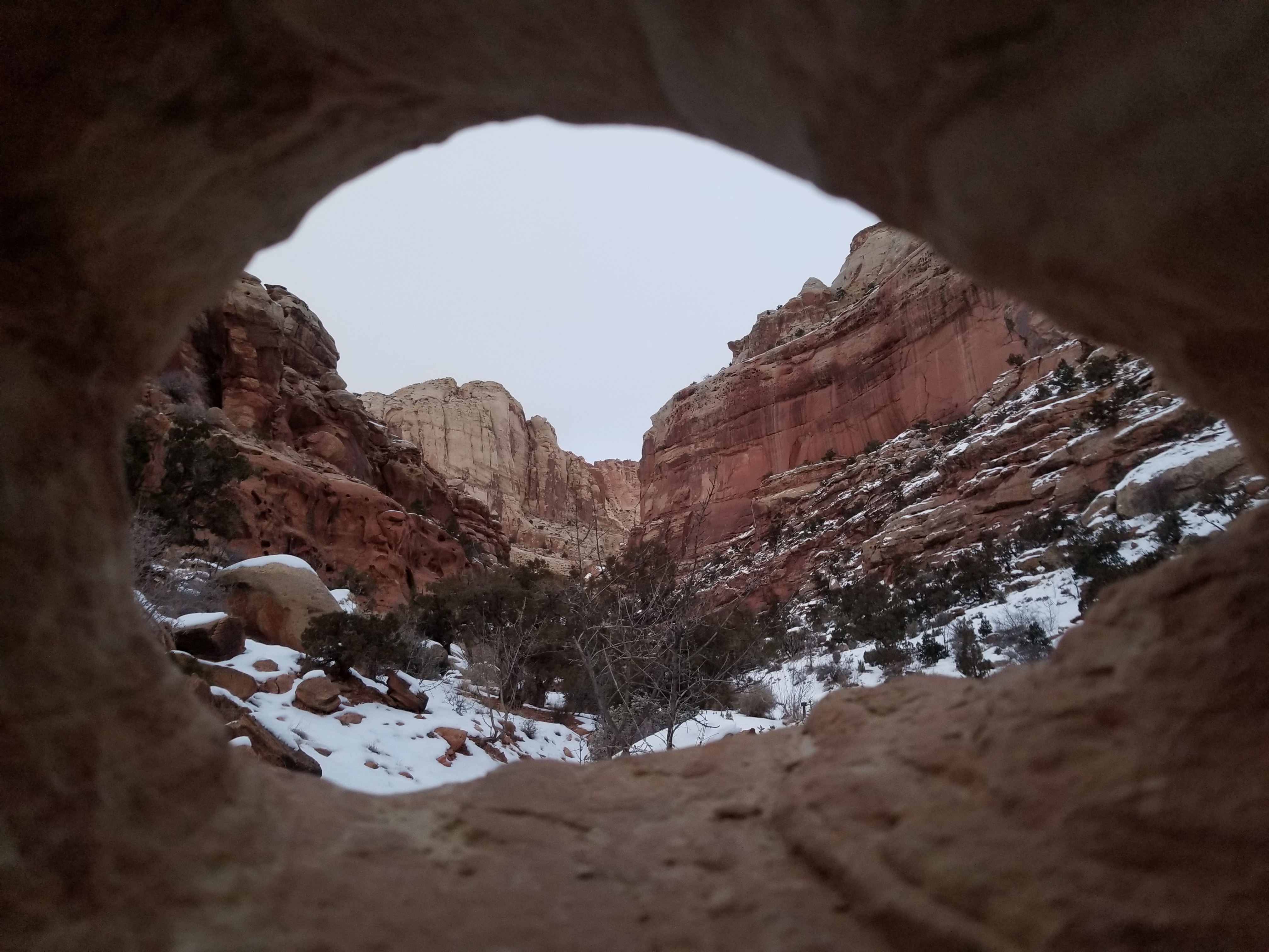 Looking out from the inside of a small cave in Capitol Reef National Park