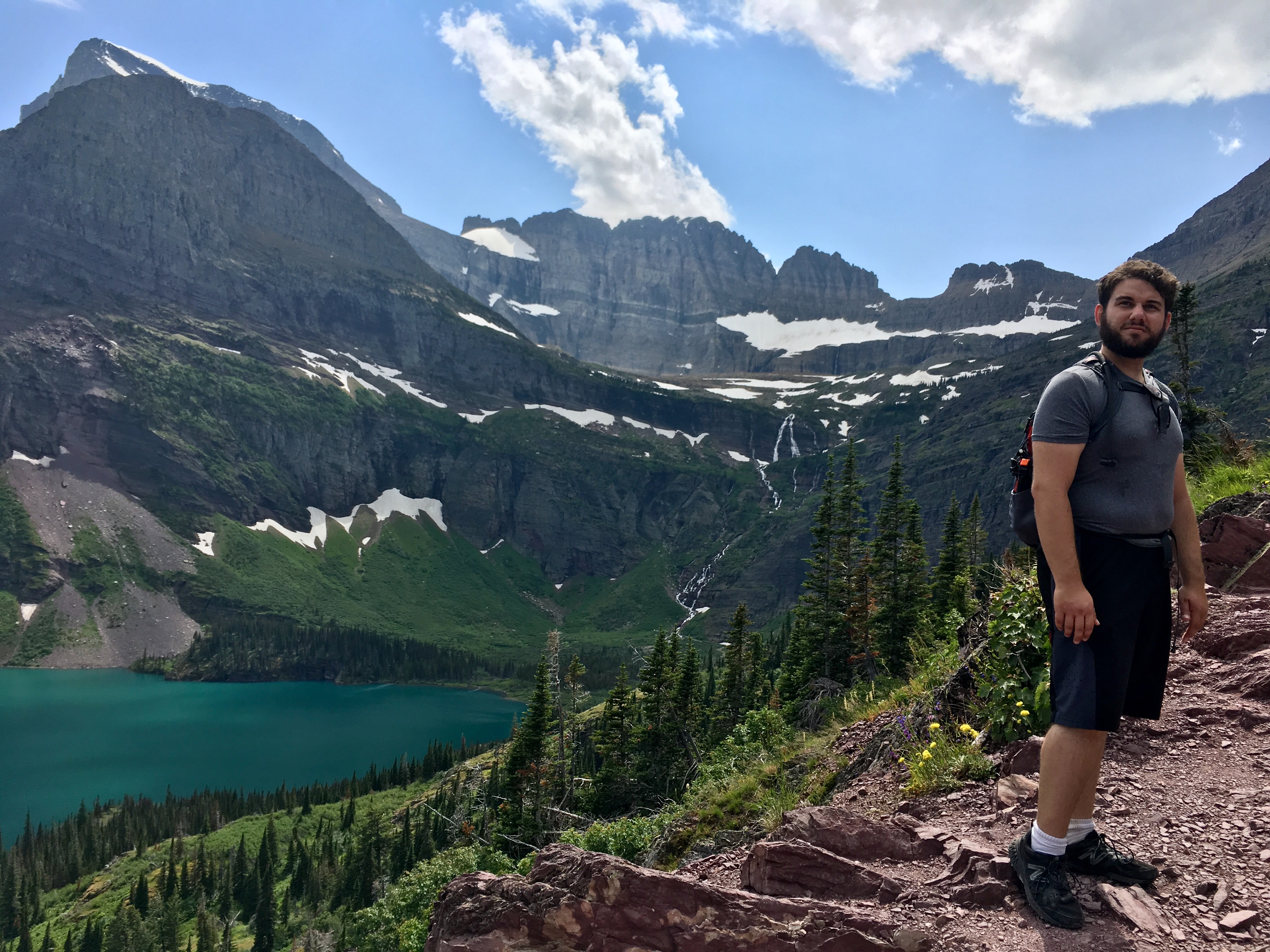 Josh trying to be America’s Next Top model on our hike towards Grinell Glacier (behind him). Super blue Grinell lake pictured as well. In Glacier NP