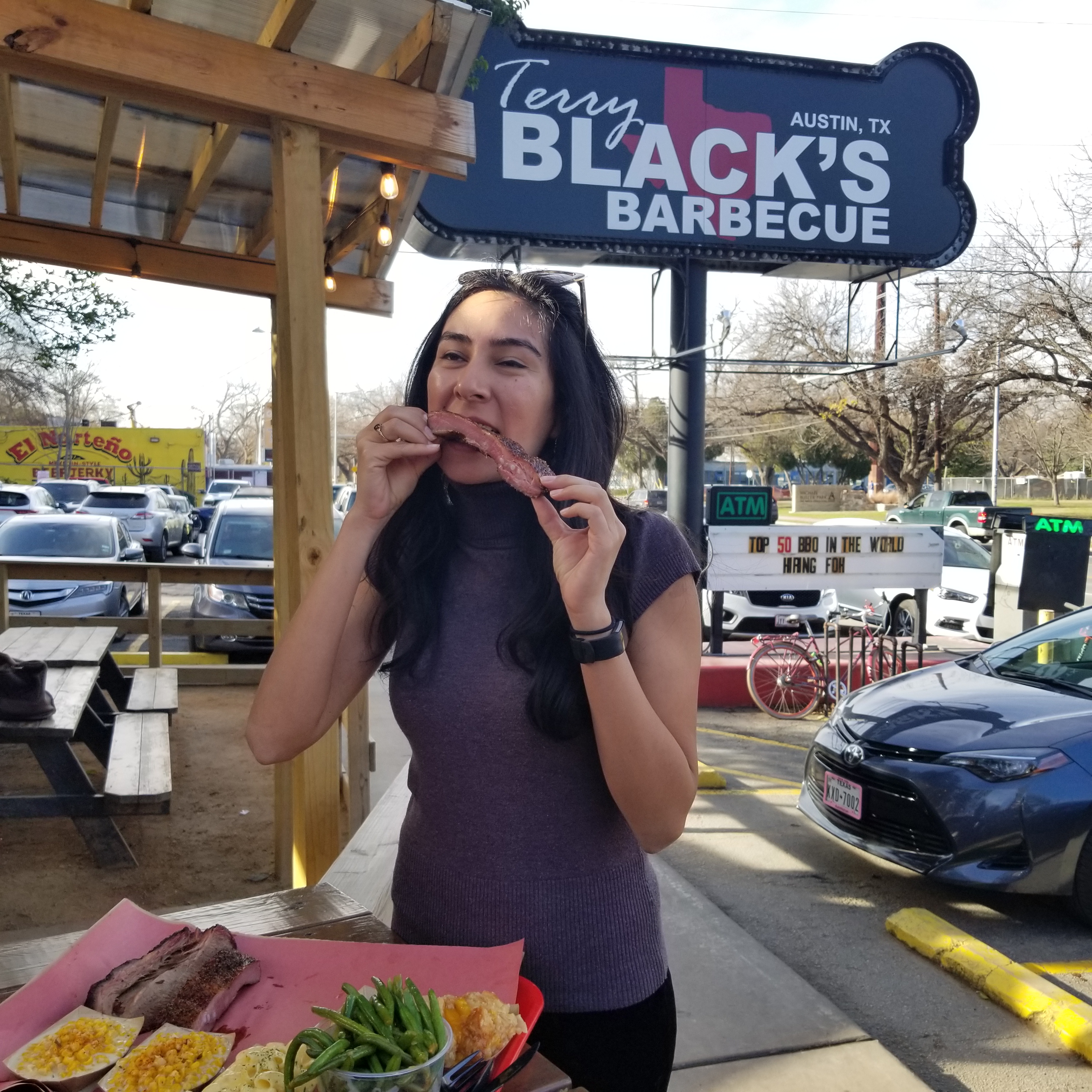 Having barbecue at Terry Black's BBQ, considered one of the best barbecue joints in Texas (and thus, say the Texans, in the world). It was very good.