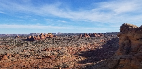 Picture of a rock formation known as "The Tepees" seen in the distance