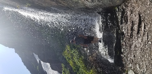 Josh discovering that water is wet on the hike to Grinnell glacier in Glacier NP, MT