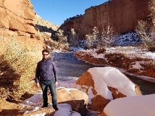 Josh in front of the Fremont river in Capitol Reef National Park. The giant cliffs of Capitol Reef were cut by this trickle of water over millions of years.