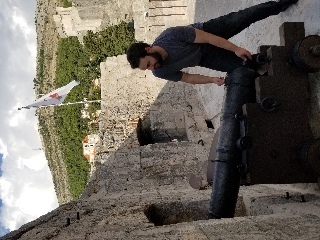 Josh fires a cannon from the walls of Dubrovnik