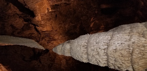 Giant stalagmite and stalactite growing towards each other in Carlsbad Caverns